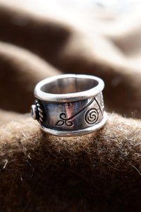 Sterling silver Pictish ring with faceted topaz.