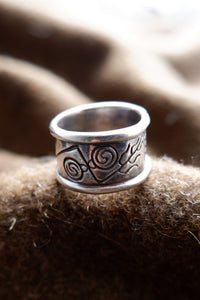 Sterling silver Pictish ring with faceted topaz.