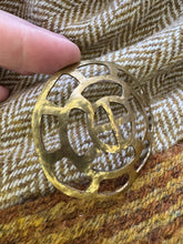 Load image into Gallery viewer, Frankish openwork belt mount in brass. Sunwheel?