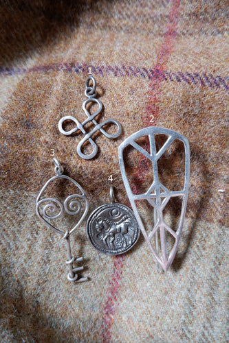 Silver Pendants and a Brooch