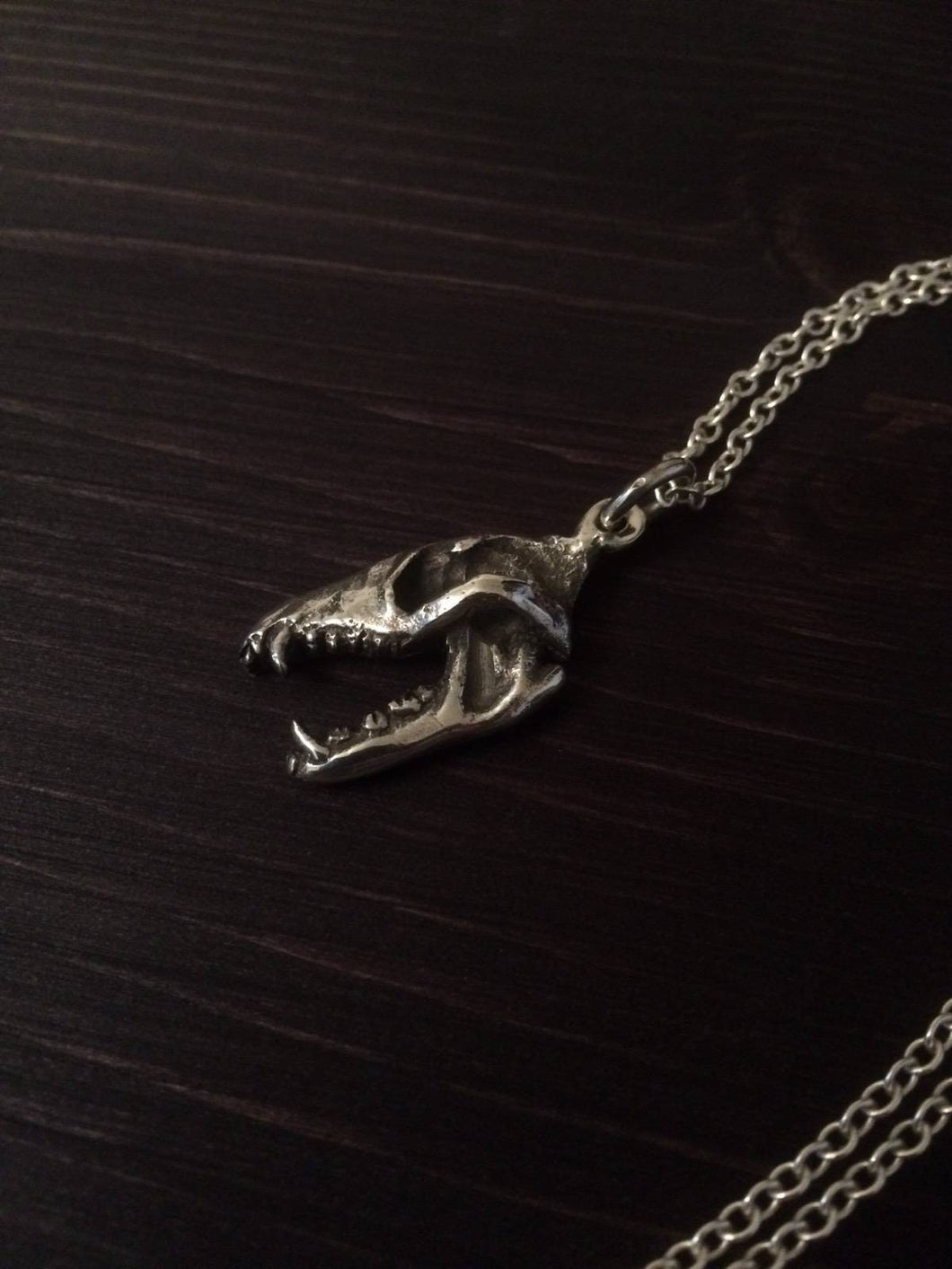 One Sided Wolf skull pendant in bronze