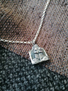Anglo Saxon "hacksilver" pendant based on a real artefact